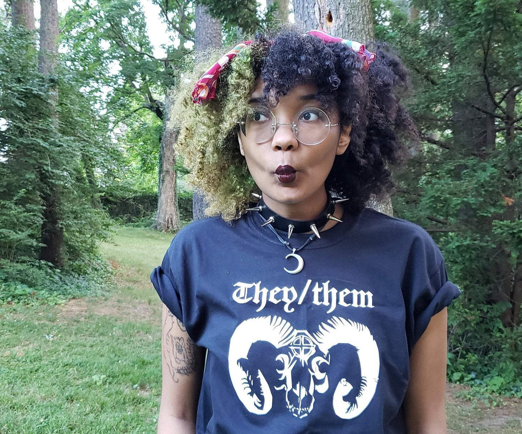 They/them variation of the Satanic Goat Pronouns tee, worn by model